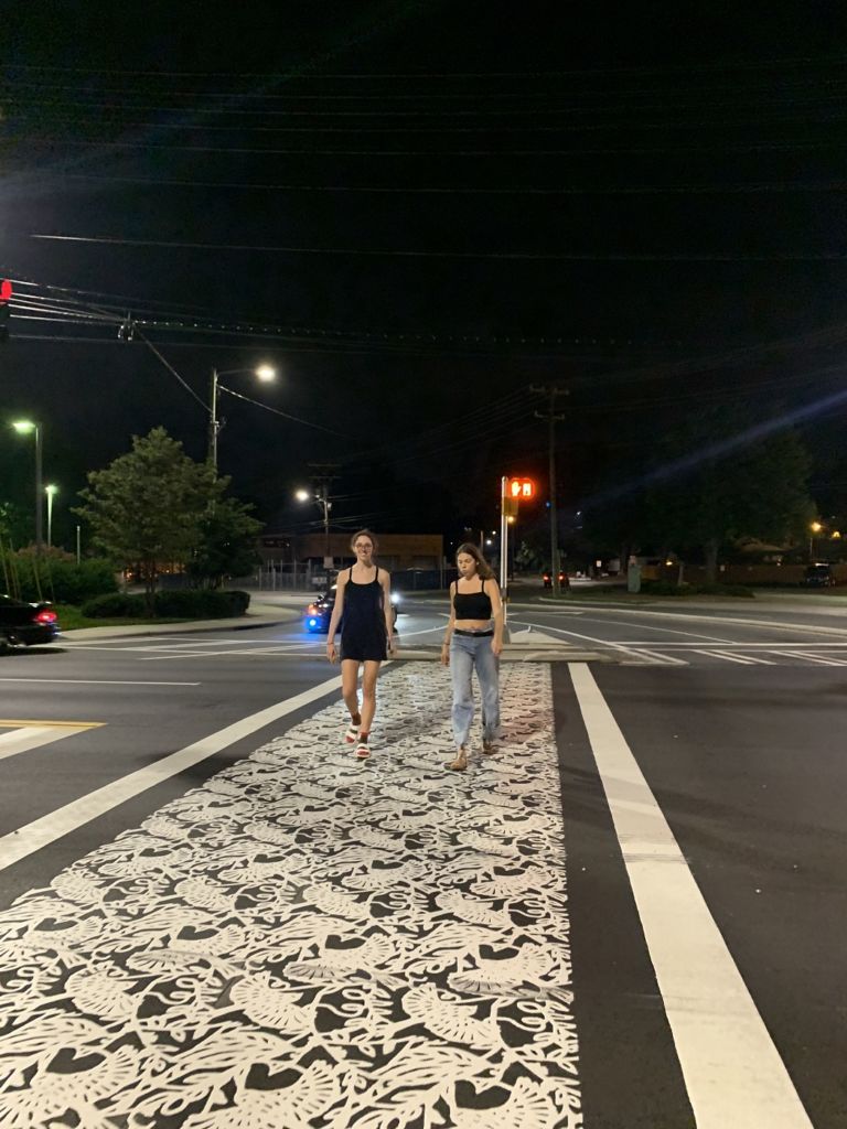 An artistic crosswalk is part of the public art project “A Good Sign” by artist team Wowhaus.