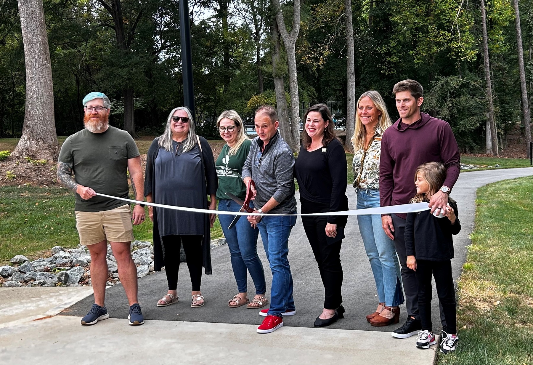 Huntersville Public Art Commission members and town elected officials and their family and friends at the ceremonial ribbon-cutting for the SCULPTOUR exhibition. 