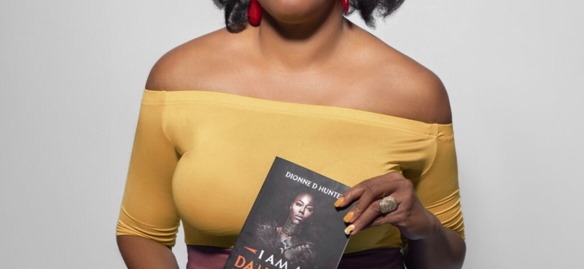 A portrait of Dionne Hunter holding her