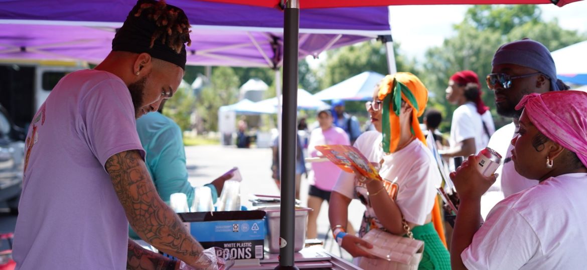 Durag Fest attendees purchase wares from a local vendor.