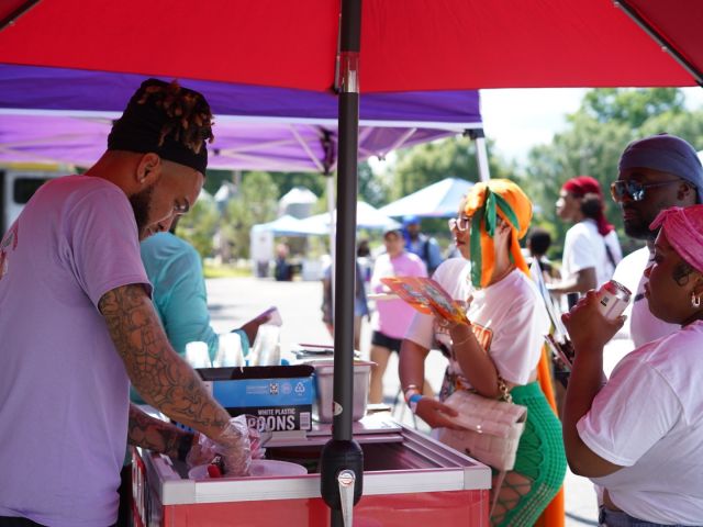 Durag Fest attendees purchase wares from a local vendor.